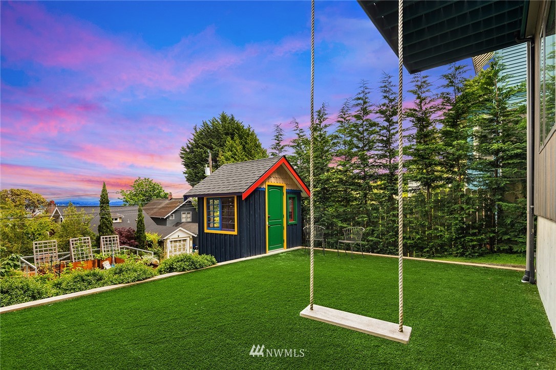 1618 37th Avenue Seattle, WA 98122 - Photo 29 of 39 a view of a house with a yard
