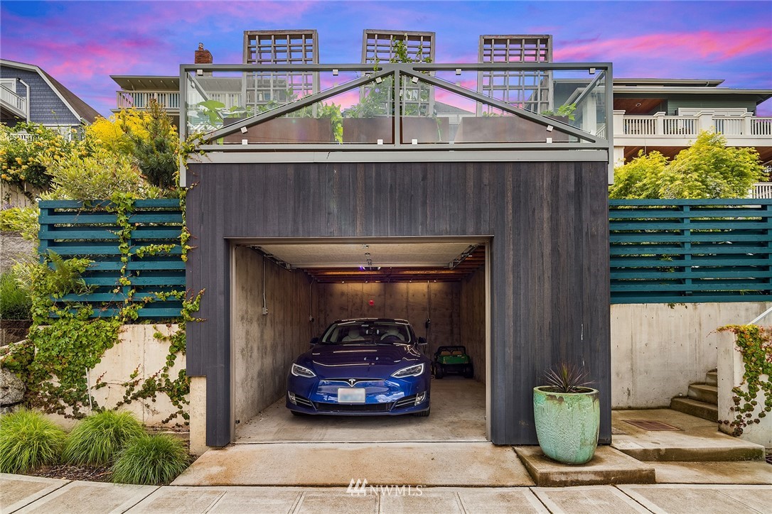 1618 37th Avenue Seattle, WA 98122 - Photo 37 of 39 a car parked in front of a house