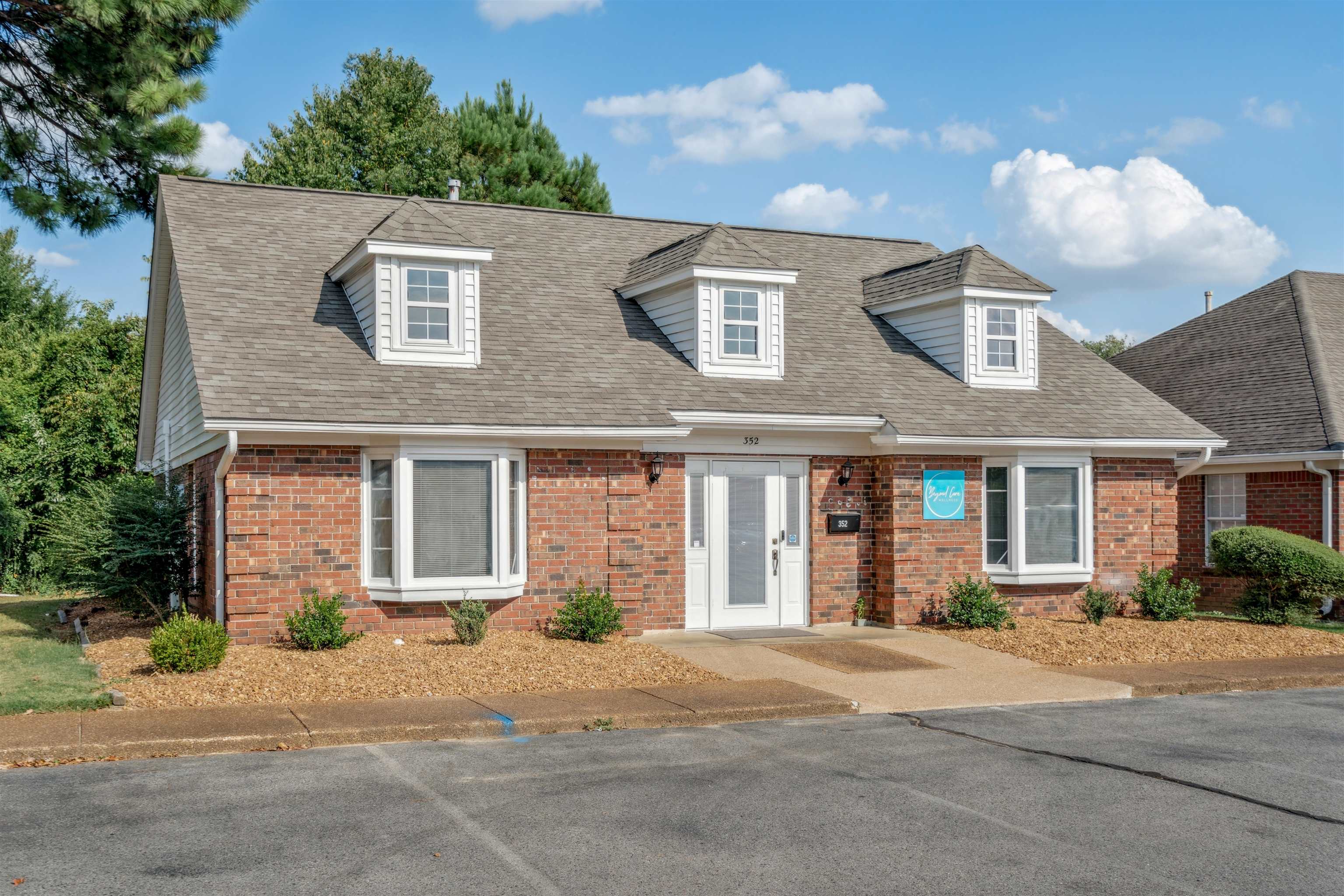 352 Poplar View Lane East Collierville, TN 38017 - Photo 3 of 16 a front view of a house with a yard and a garage