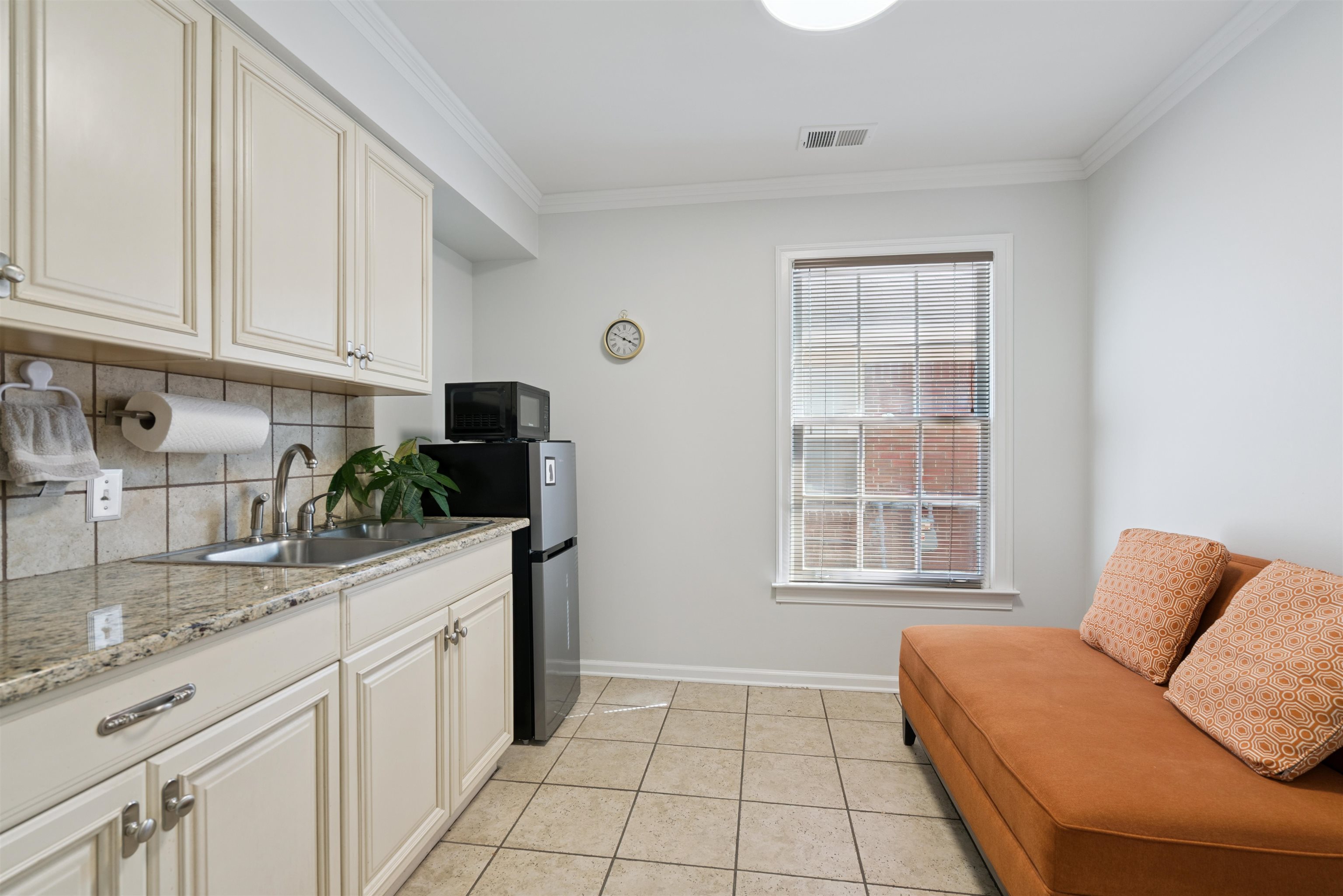 352 Poplar View Lane East Collierville, TN 38017 - Photo 8 of 16 a kitchen with stainless steel appliances granite countertop a sink dishwasher and white cabinets with wooden floor