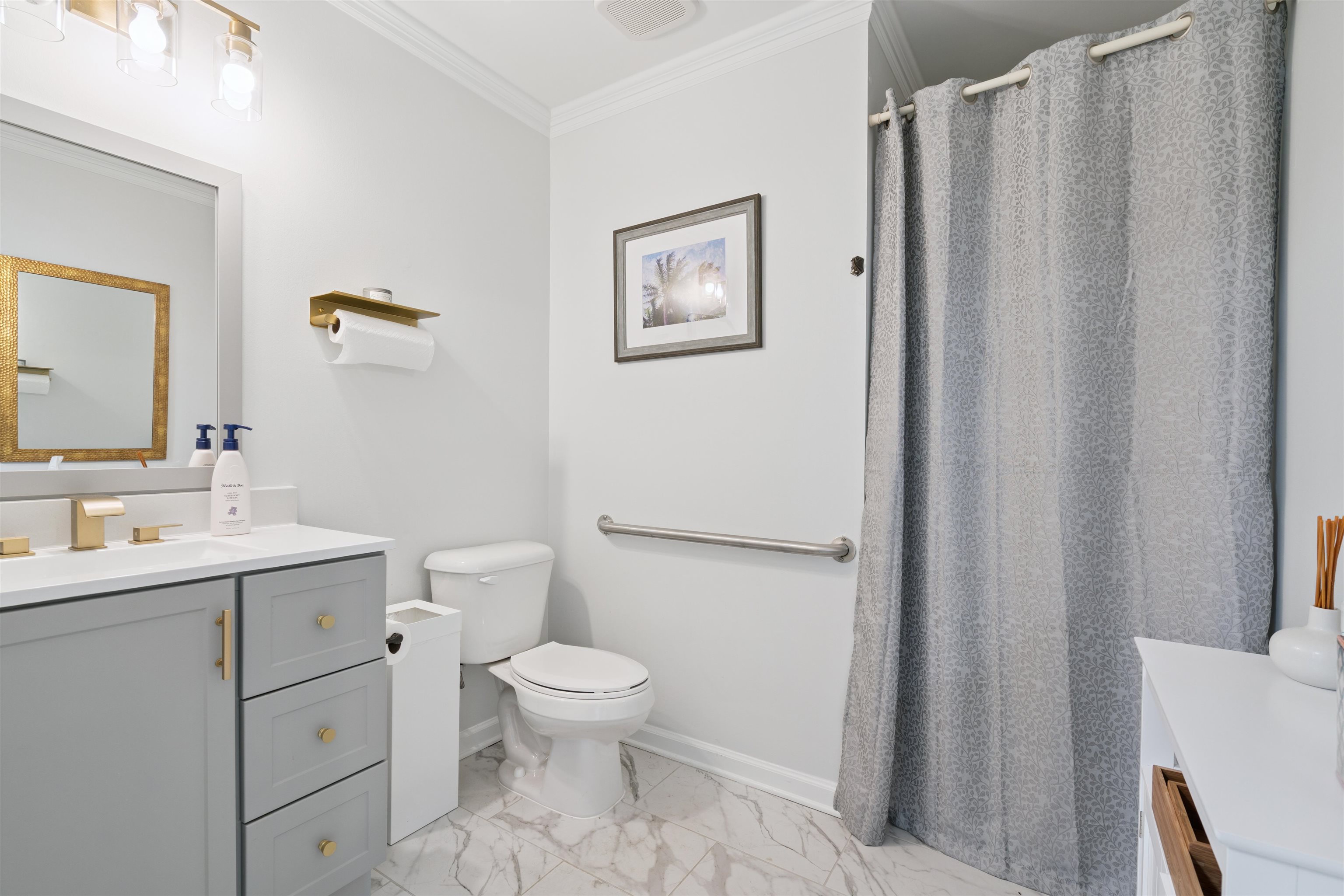 352 Poplar View Lane East Collierville, TN 38017 - Photo 9 of 16 a white toilet sitting next to a bathroom sink