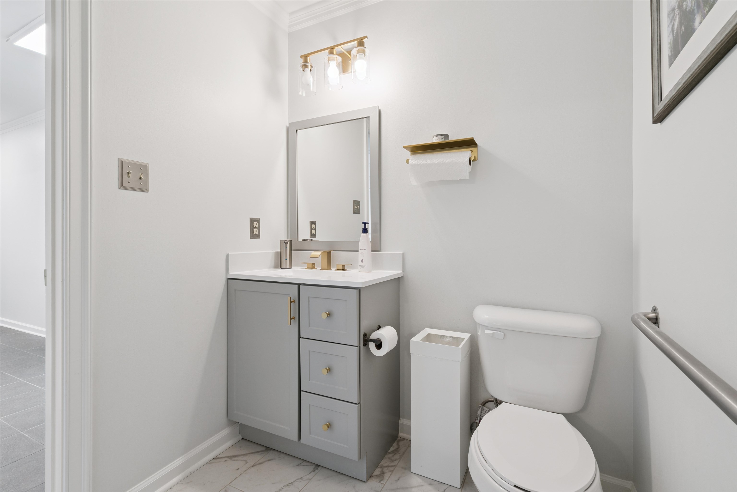 352 Poplar View Lane East Collierville, TN 38017 - Photo 10 of 16 a bathroom with a toilet sink and mirror