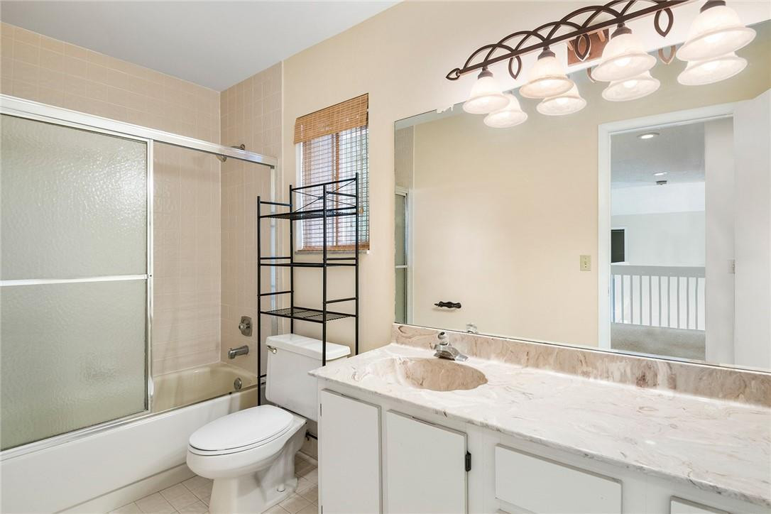 6535 Parkview Drive, Unit G Boca Raton, FL 33433 - Photo 11 of 27 a bathroom with a granite countertop sink toilet and shower