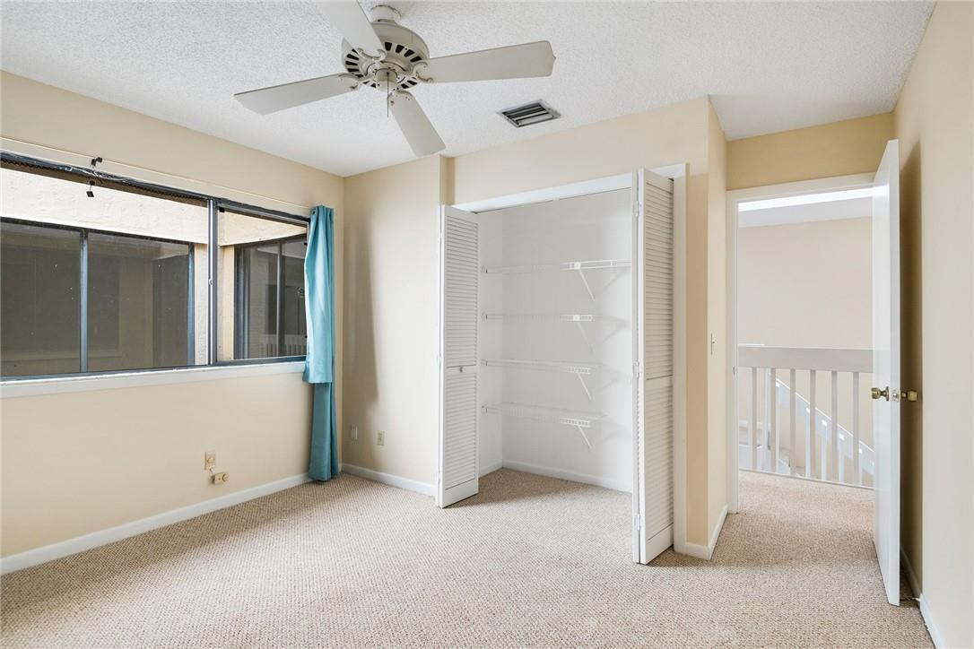 6535 Parkview Drive, Unit G Boca Raton, FL 33433 - Photo 15 of 27 a view of a hallway with a chandelier fan