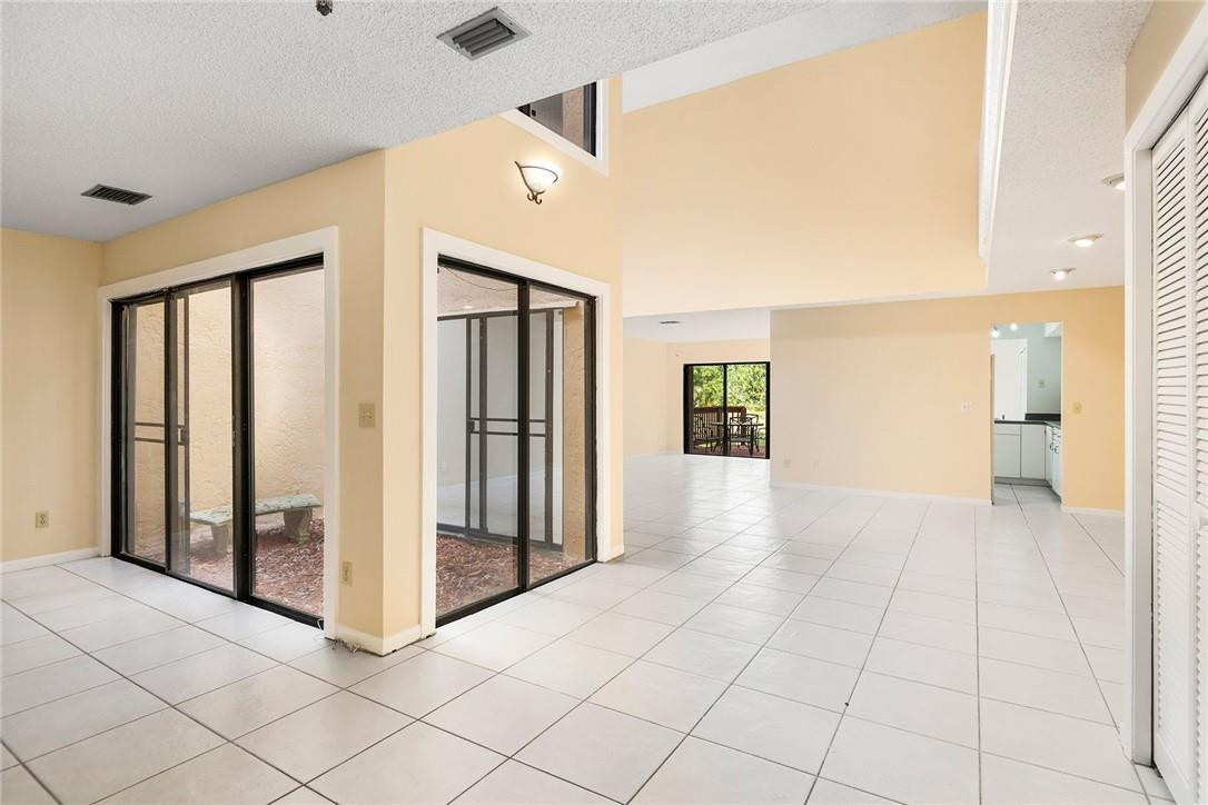 6535 Parkview Drive, Unit G Boca Raton, FL 33433 - Photo 2 of 27 a view of a hallway with wooden shelves