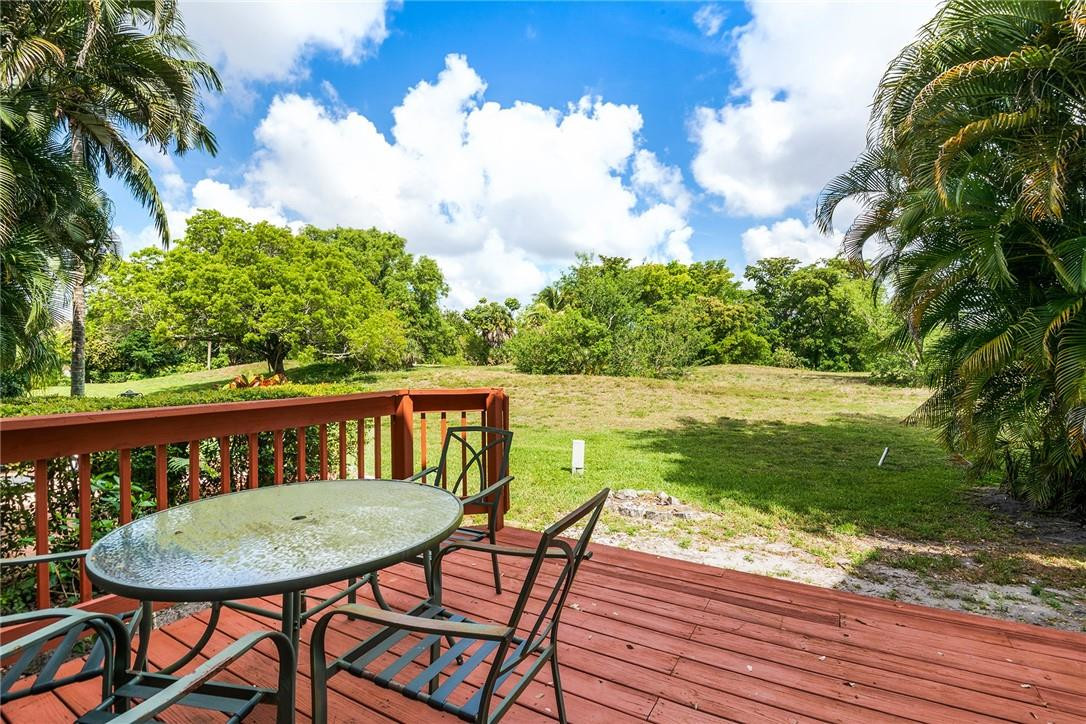 6535 Parkview Drive, Unit G Boca Raton, FL 33433 - Photo 22 of 27 a view of a chairs and table on the wooden floor