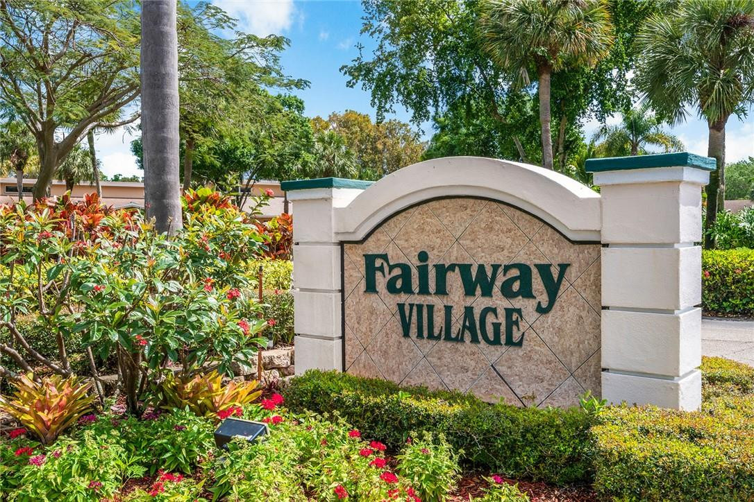 6535 Parkview Drive, Unit G Boca Raton, FL 33433 - Photo 27 of 27 a view of a garden with plants and large trees
