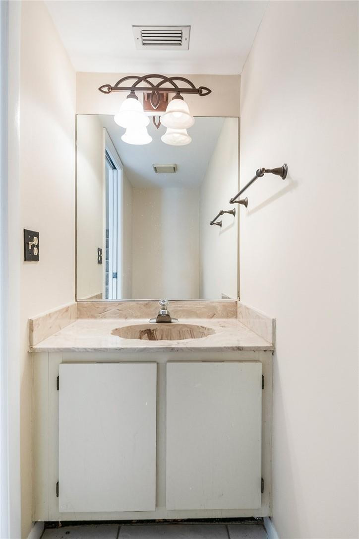 6535 Parkview Drive, Unit G Boca Raton, FL 33433 - Photo 9 of 27 a bathroom with a sink and a mirror
