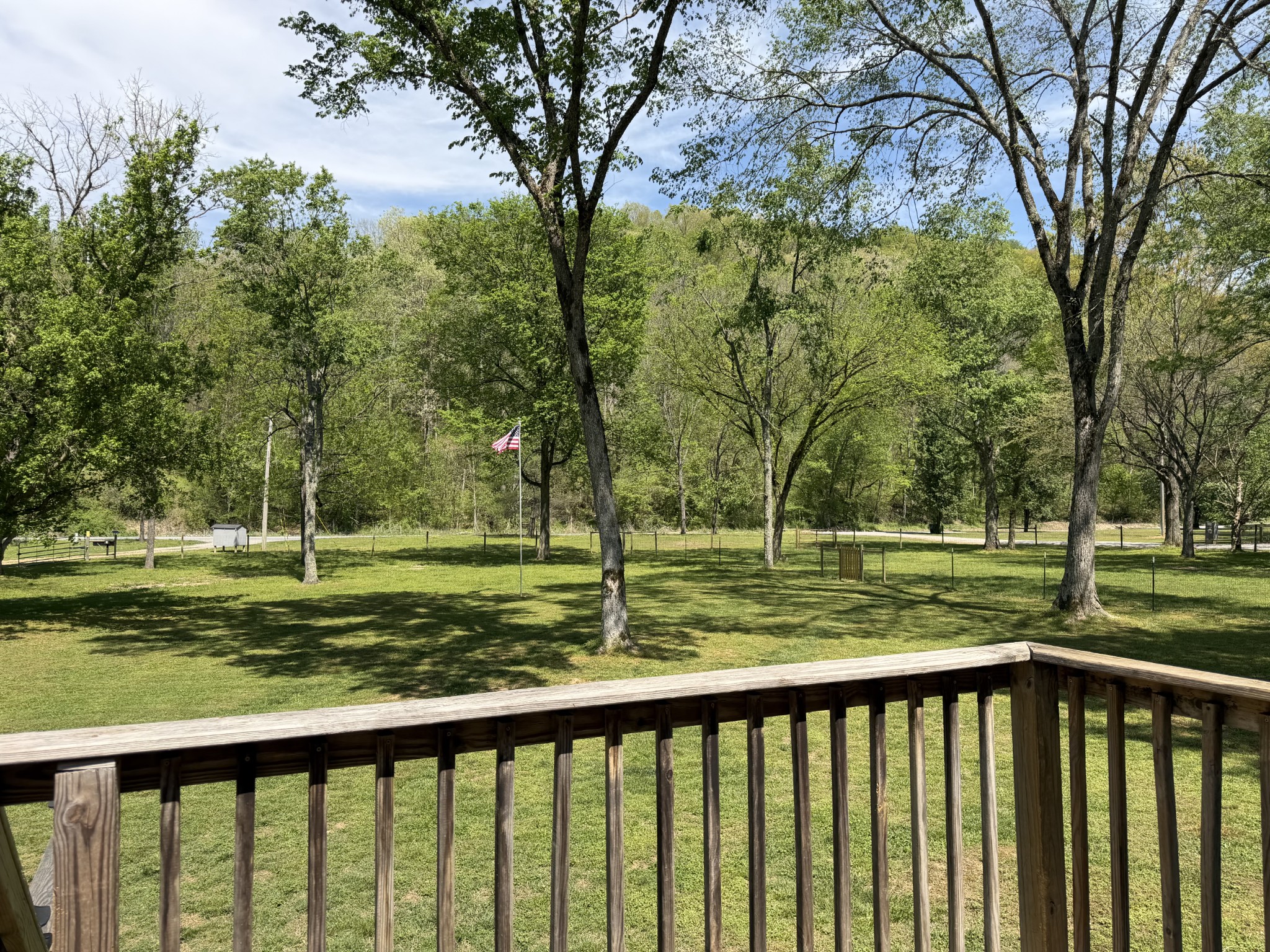 1851 Hicks Hollow Road Westmoreland, TN 37186 - Photo 9 of 12 a view of a wooden deck with a large trees