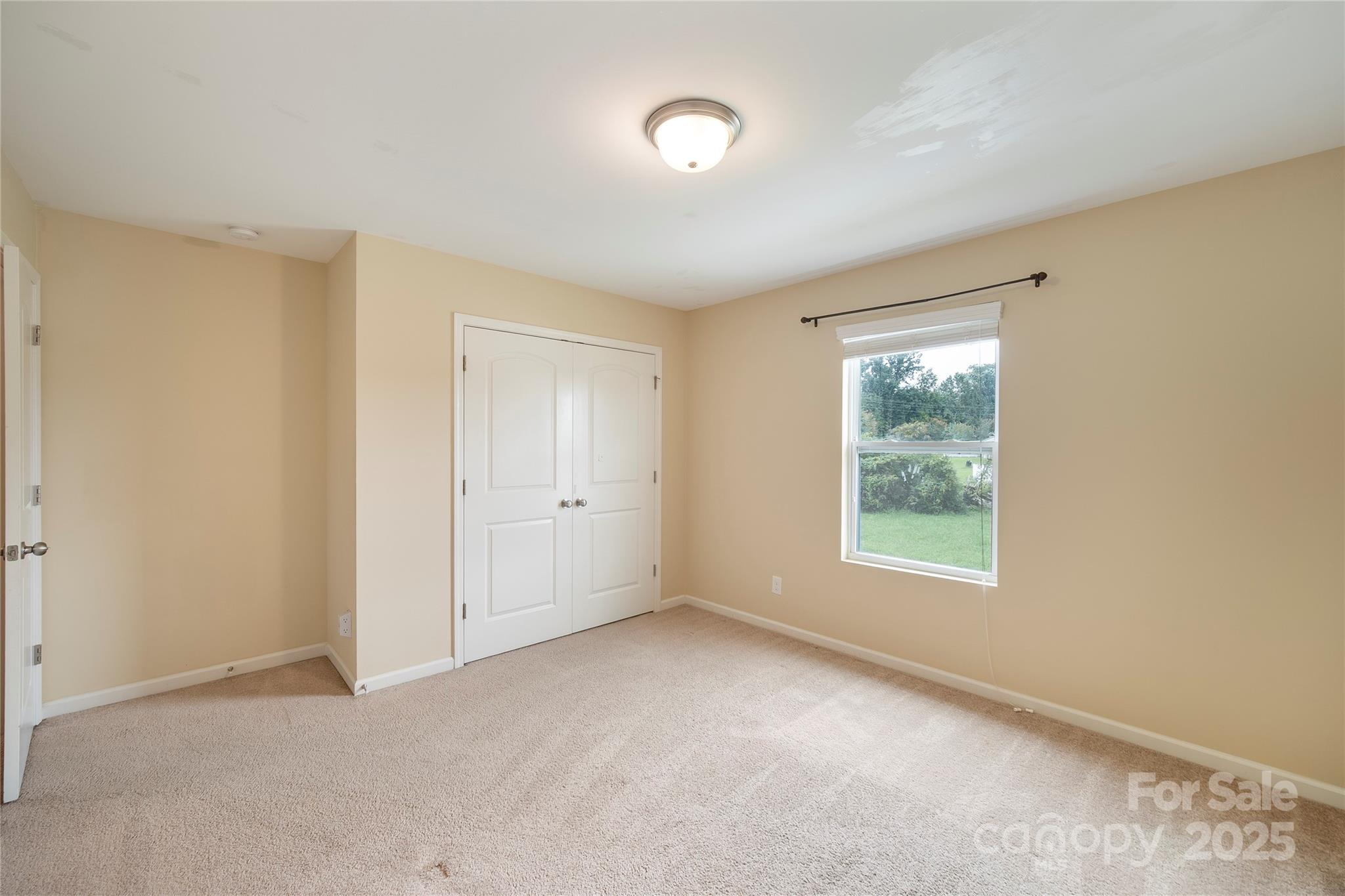 4720 Tradd Circle Monroe, NC 28110 - Photo 17 of 29 an empty room with a empty space and windows