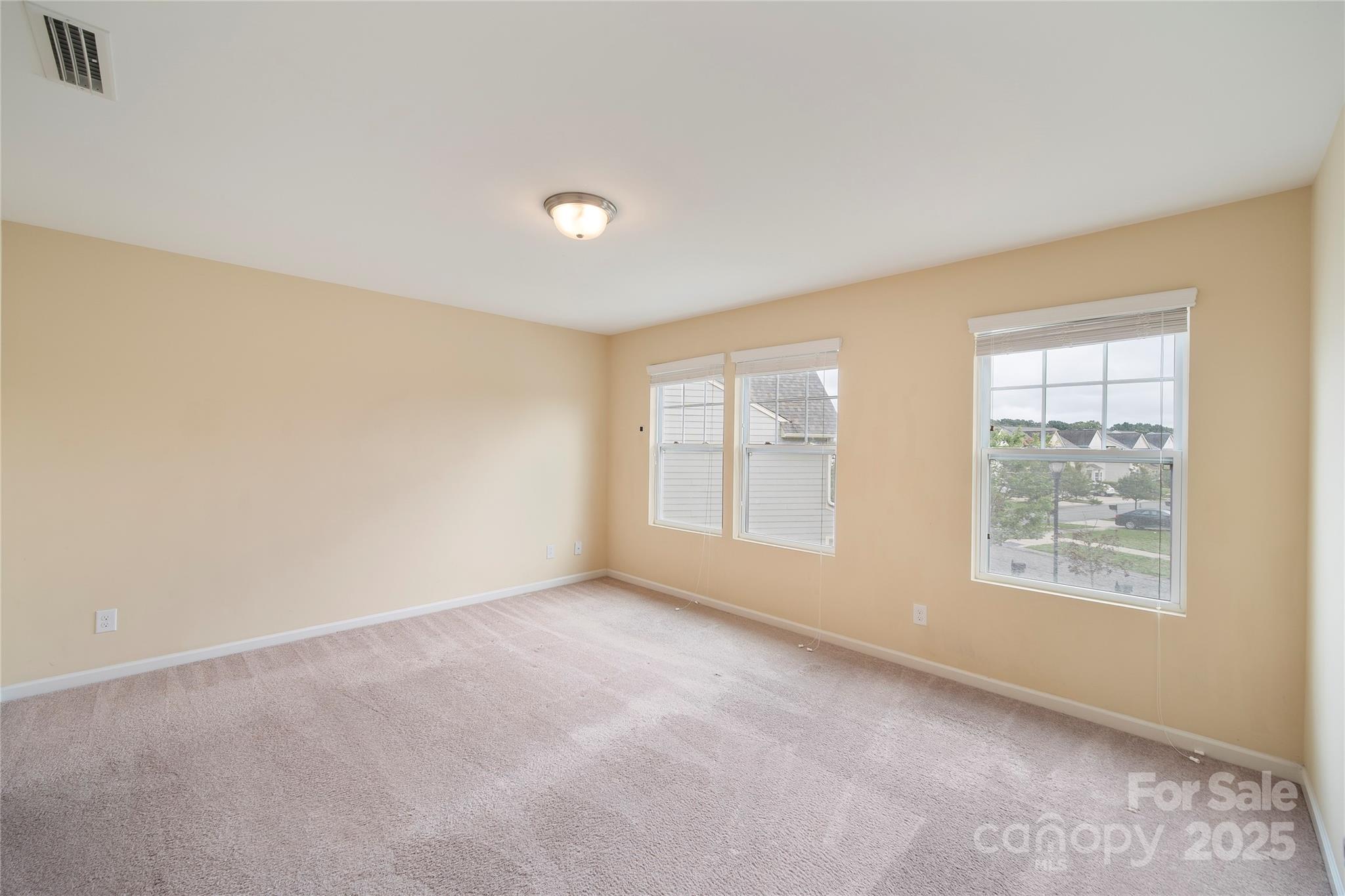 4720 Tradd Circle Monroe, NC 28110 - Photo 23 of 29 an empty room with windows