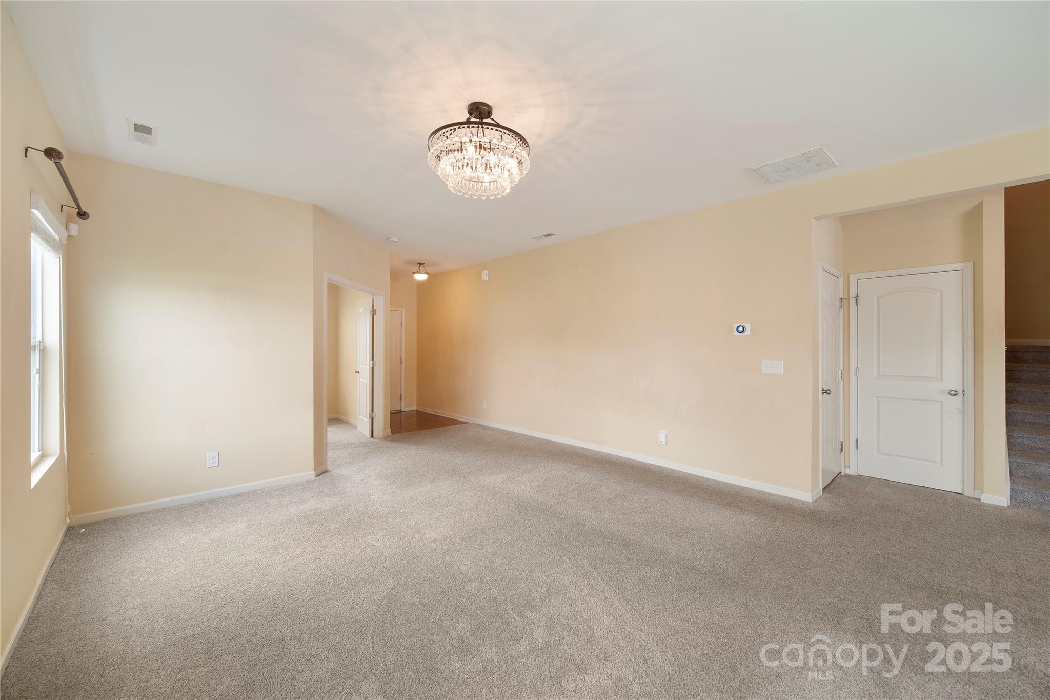 4720 Tradd Circle Monroe, NC 28110 - Photo 7 of 29 an empty room with a empty space and a window