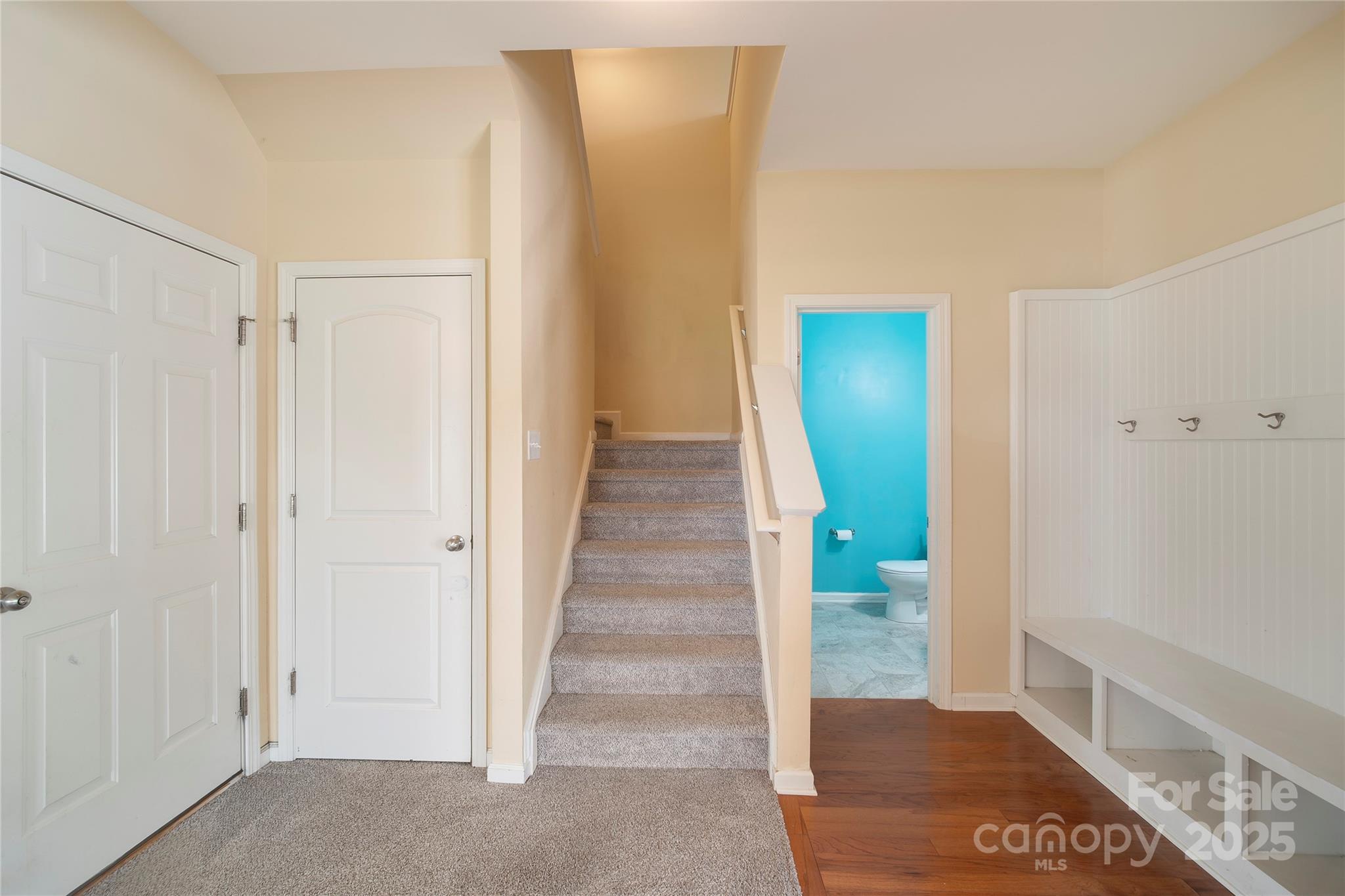 4720 Tradd Circle Monroe, NC 28110 - Photo 8 of 29 a view of a hallway with wooden floor and staircase