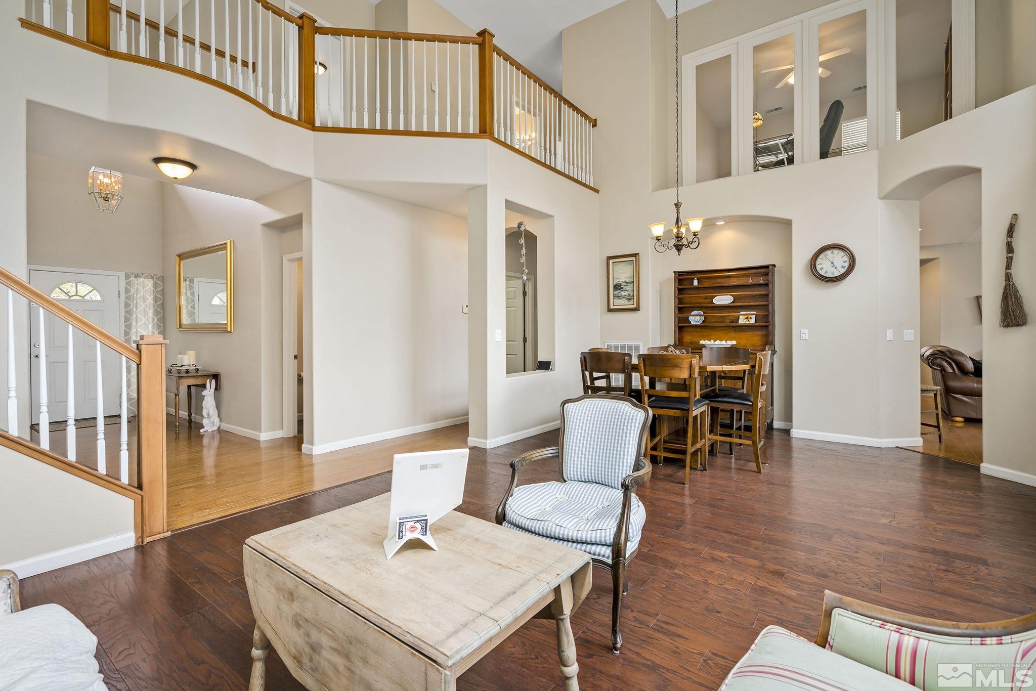 1564 Rio Grande Drive Reno, NV 89521 - Photo 5 of 33 a living room with furniture a wooden floor and a chandelier