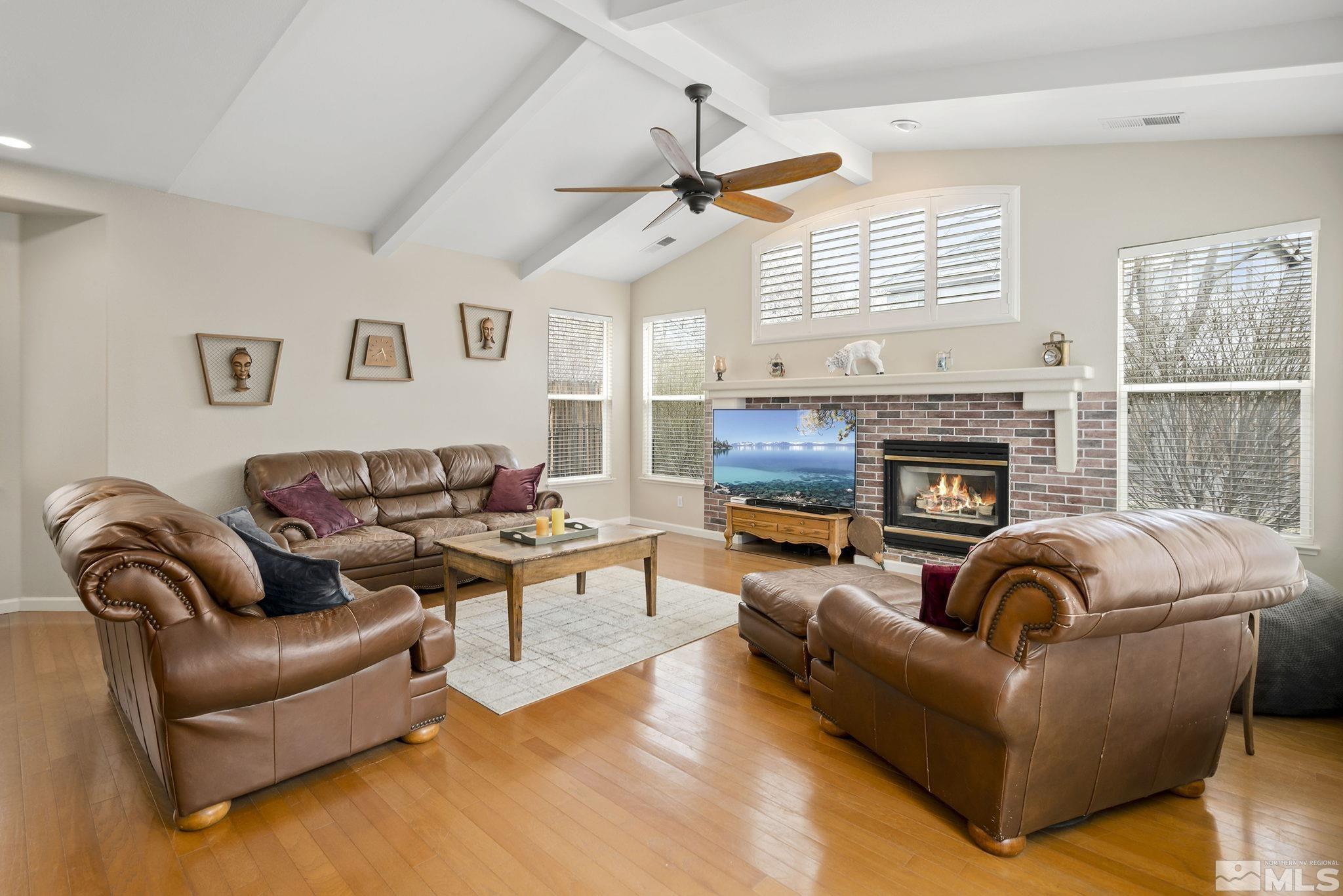 1564 Rio Grande Drive Reno, NV 89521 - Photo 7 of 33 a living room with furniture fireplace and a large window