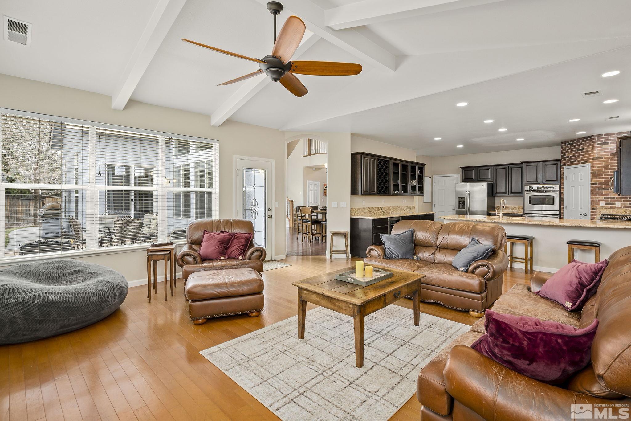 1564 Rio Grande Drive Reno, NV 89521 - Photo 8 of 33 a living room with furniture a ceiling fan and a rug