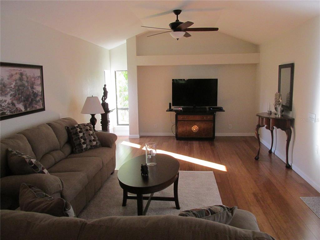 1767 Belvidere Road Englewood, FL 34223 - Photo 6 of 15 a living room with furniture and a flat screen tv