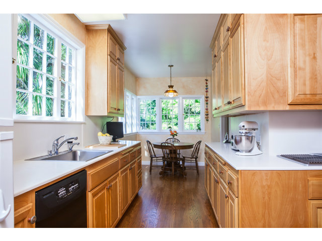 461 Fulton Road San Mateo, CA 94402 - Photo 5 of 14 a kitchen with a sink a counter top space and living room area