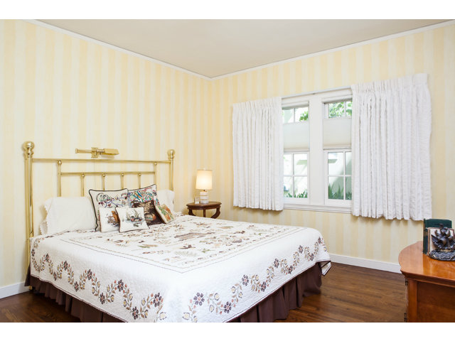 461 Fulton Road San Mateo, CA 94402 - Photo 7 of 14 a bedroom with a bed and a night stand