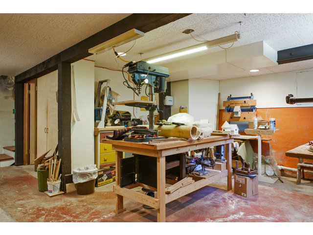 461 Fulton Road San Mateo, CA 94402 - Photo 10 of 14 a living room with lots of furniture and clutter