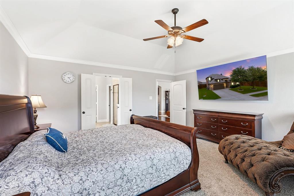 1105 Safrano Street Midlothian, TX 76065 - Photo 11 of 25 a bed room with a bed window and a flat screen tv