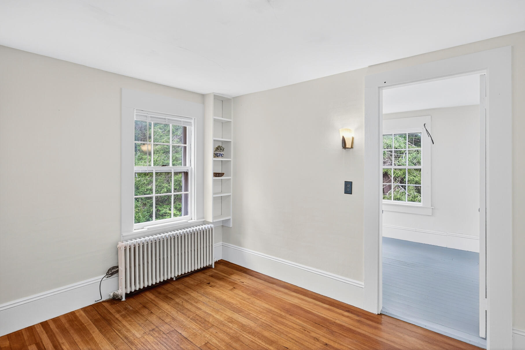 54 Whitman Road Woods Hole, MA 02543 - Photo 25 of 76 an empty room with wooden floor and windows