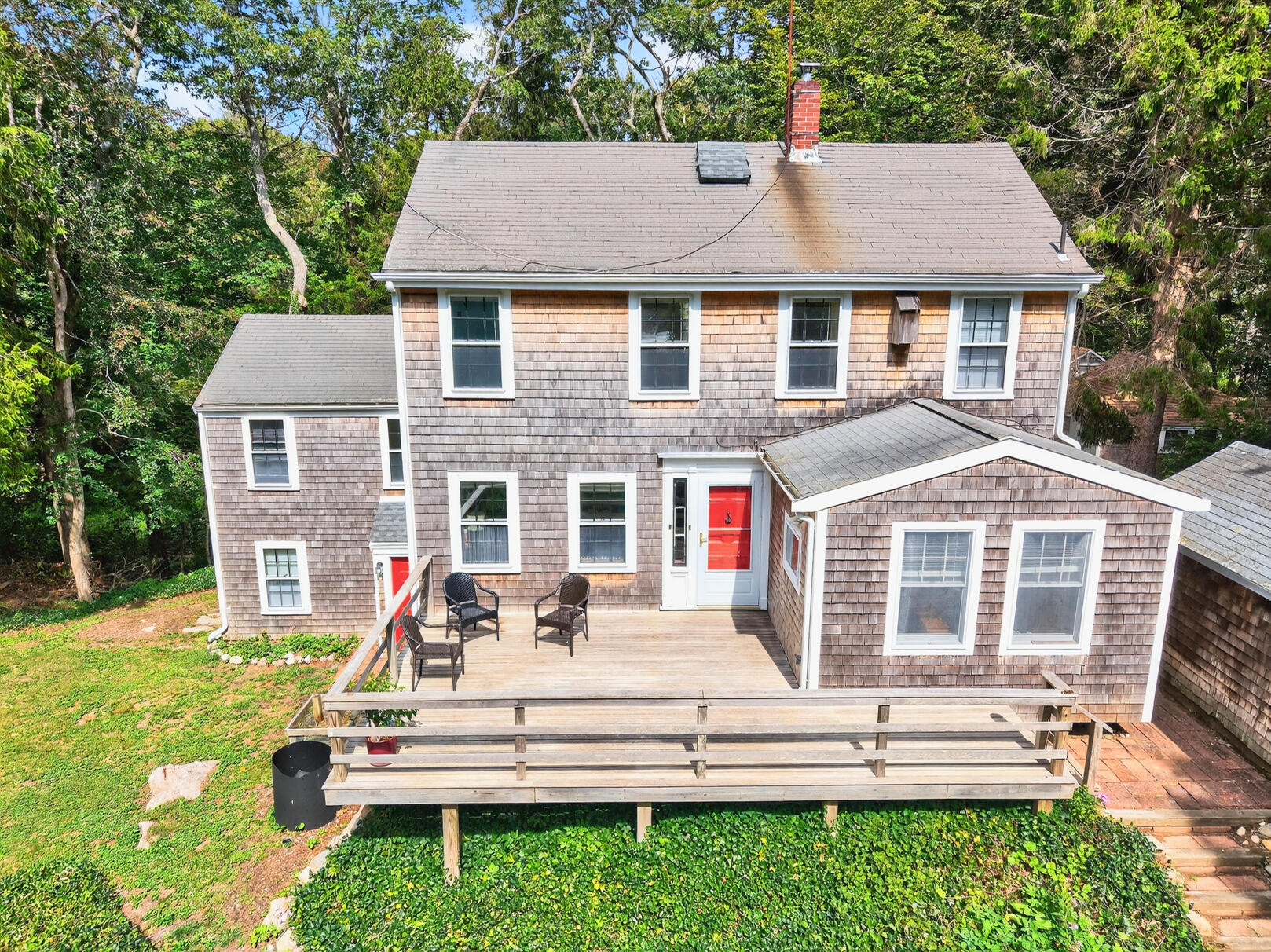 54 Whitman Road Woods Hole, MA 02543 - Photo 33 of 76 a front view of a house with a yard