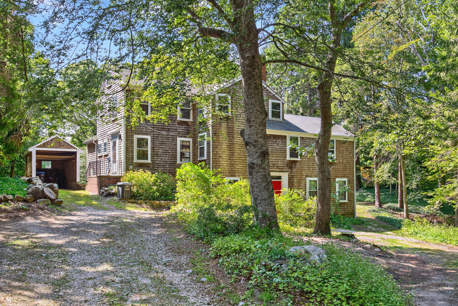 54 Whitman Road Woods Hole, MA 02543 - Photo 49 of 76 front view of a house with a yard