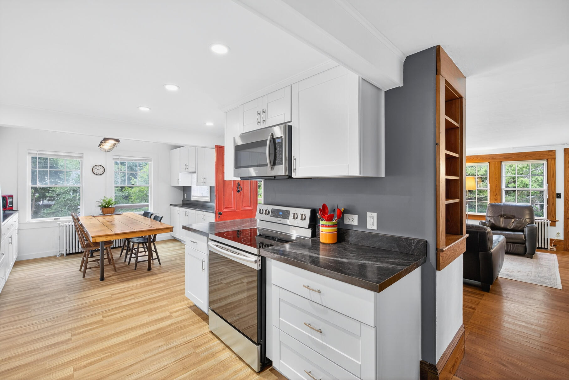 54 Whitman Road Woods Hole, MA 02543 - Photo 8 of 76 a kitchen with stainless steel appliances granite countertop a stove a sink dishwasher and a refrigerator with wooden floor