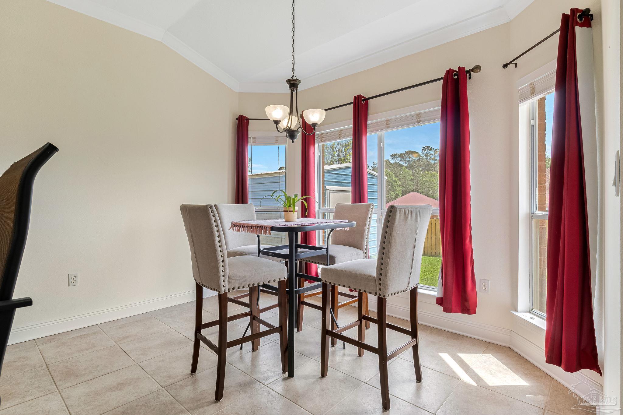 2822 Frederick Street Cantonment, FL 32533 - Photo 11 of 57 a dining room with furniture and window