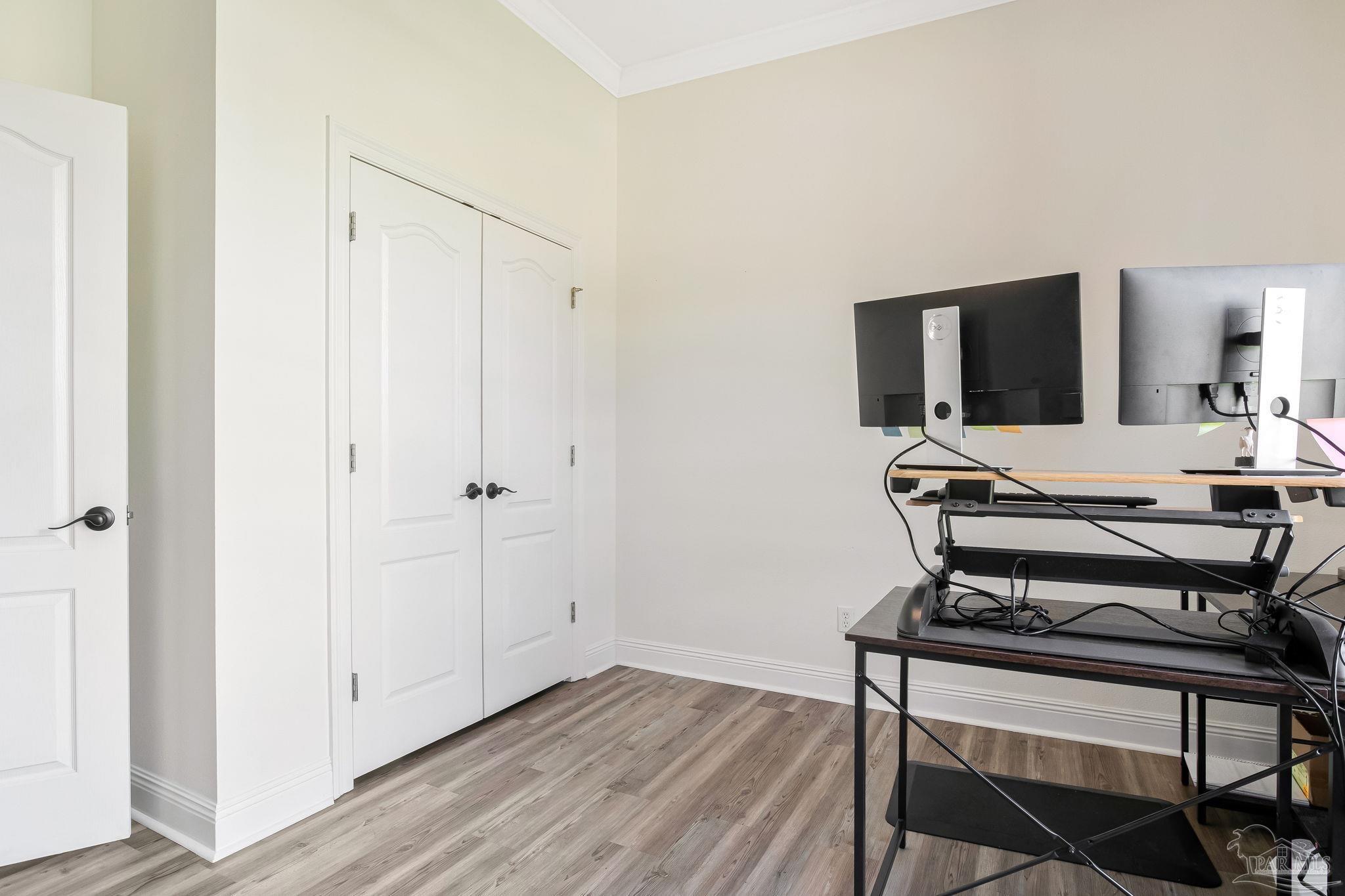 2822 Frederick Street Cantonment, FL 32533 - Photo 15 of 57 a living room with furniture and a flat screen tv