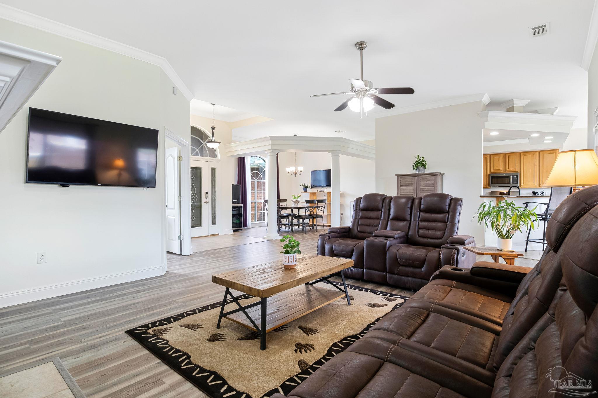 2822 Frederick Street Cantonment, FL 32533 - Photo 17 of 57 a living room with furniture and a flat screen tv