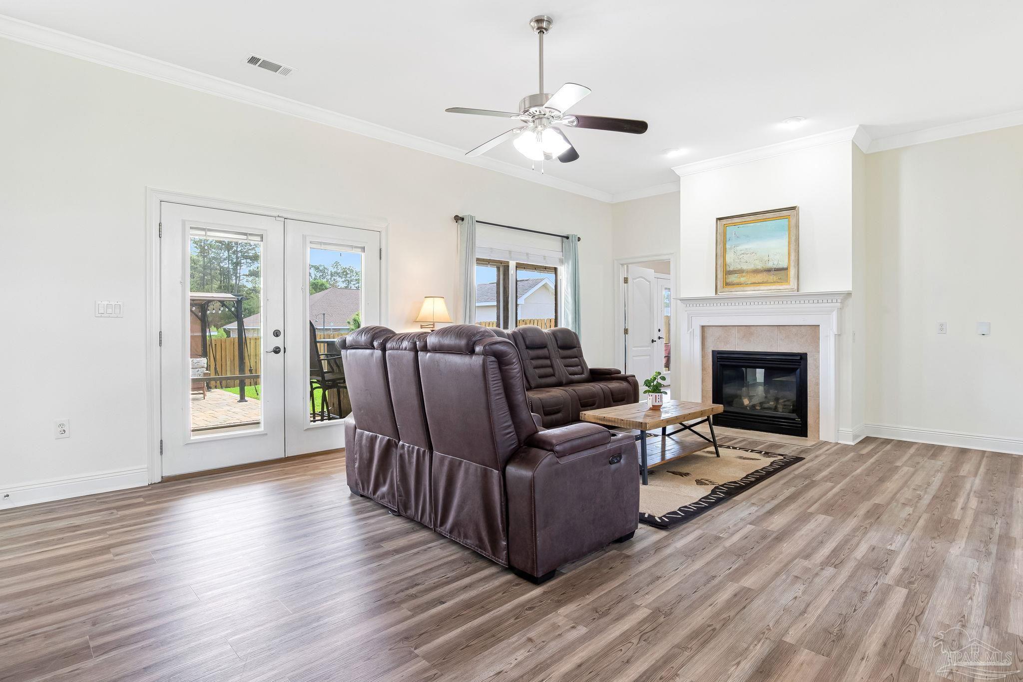 2822 Frederick Street Cantonment, FL 32533 - Photo 18 of 57 a living room with furniture and a fireplace