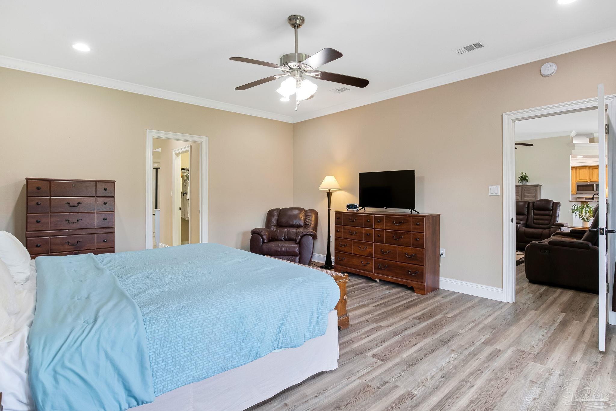 2822 Frederick Street Cantonment, FL 32533 - Photo 30 of 57 a bed room with a bed and a television