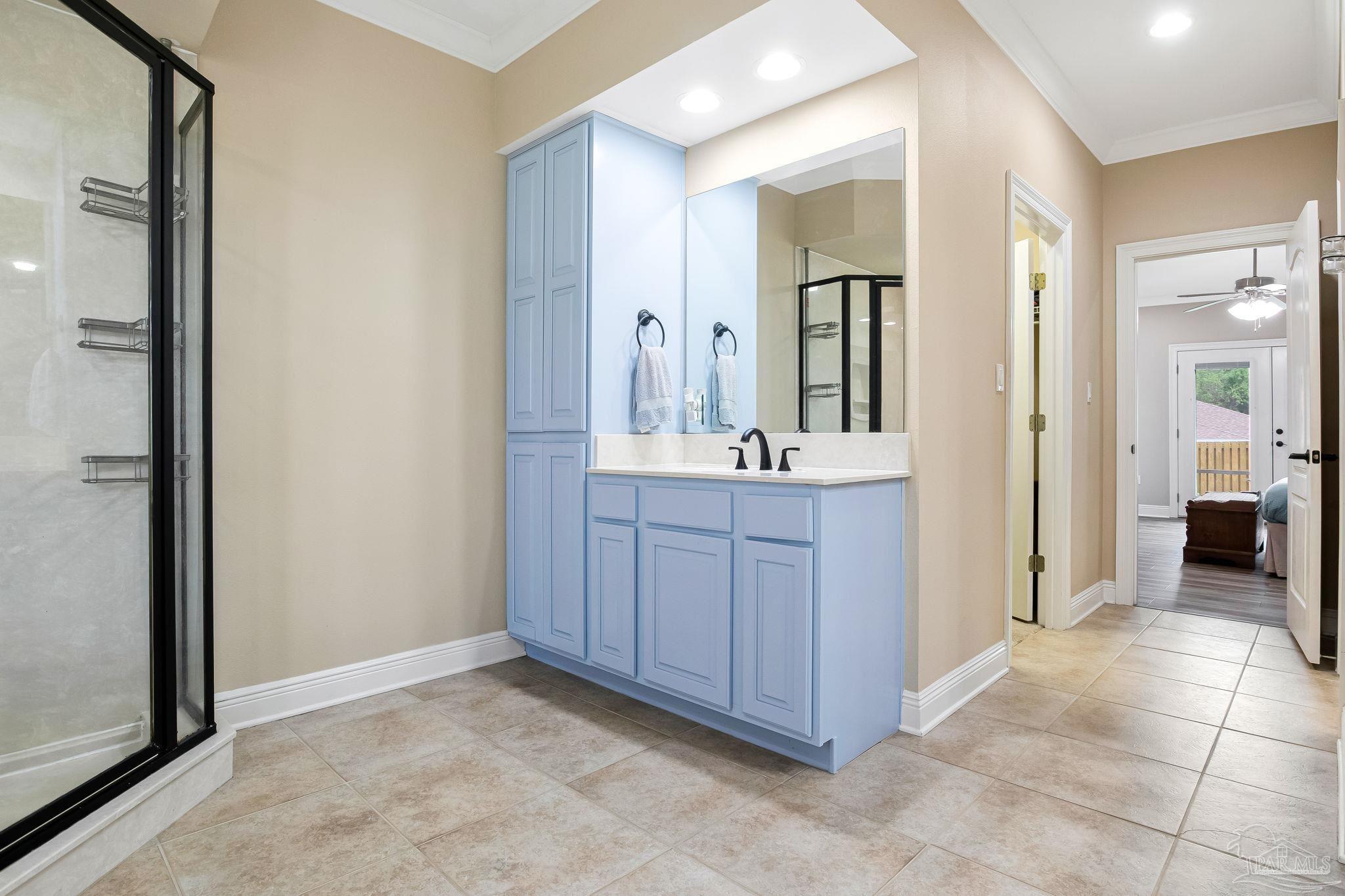 2822 Frederick Street Cantonment, FL 32533 - Photo 34 of 57 a bathroom with a sink and a mirror