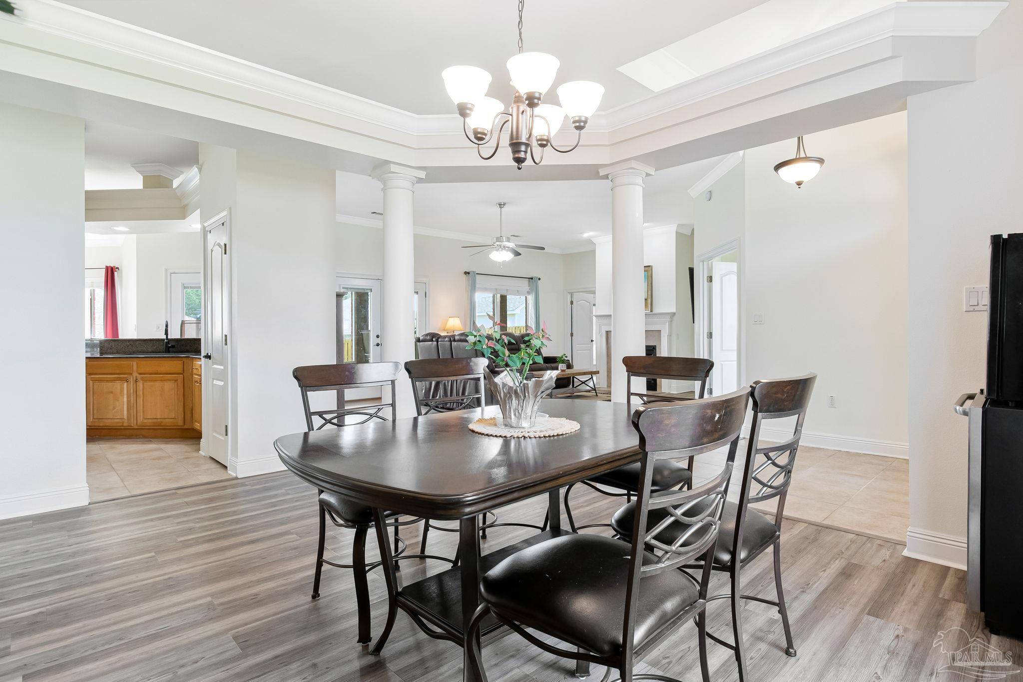 2822 Frederick Street Cantonment, FL 32533 - Photo 4 of 57 a view of a dining room with furniture and wooden floor