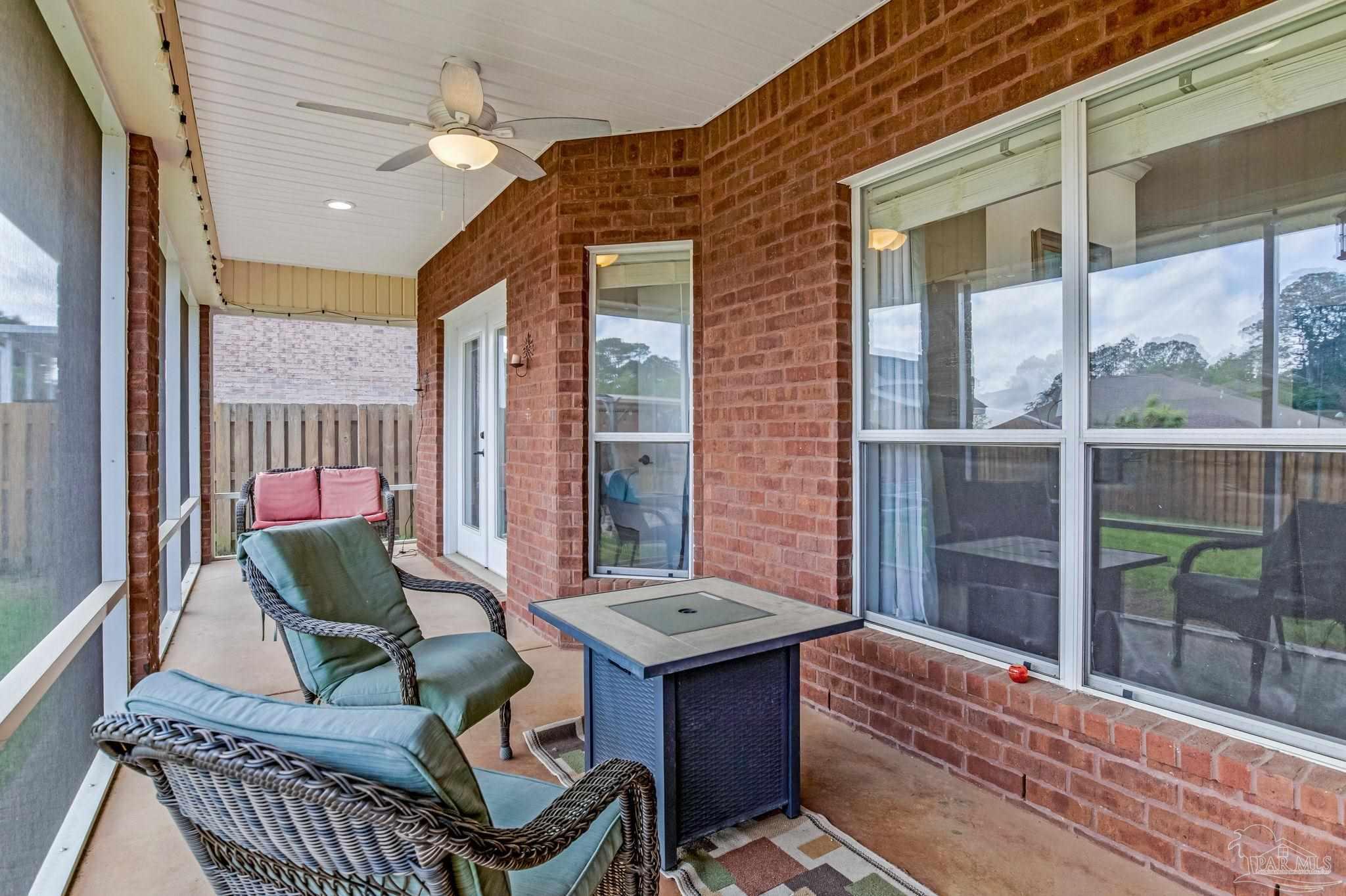 2822 Frederick Street Cantonment, FL 32533 - Photo 42 of 57 a balcony with furniture and a potted plant