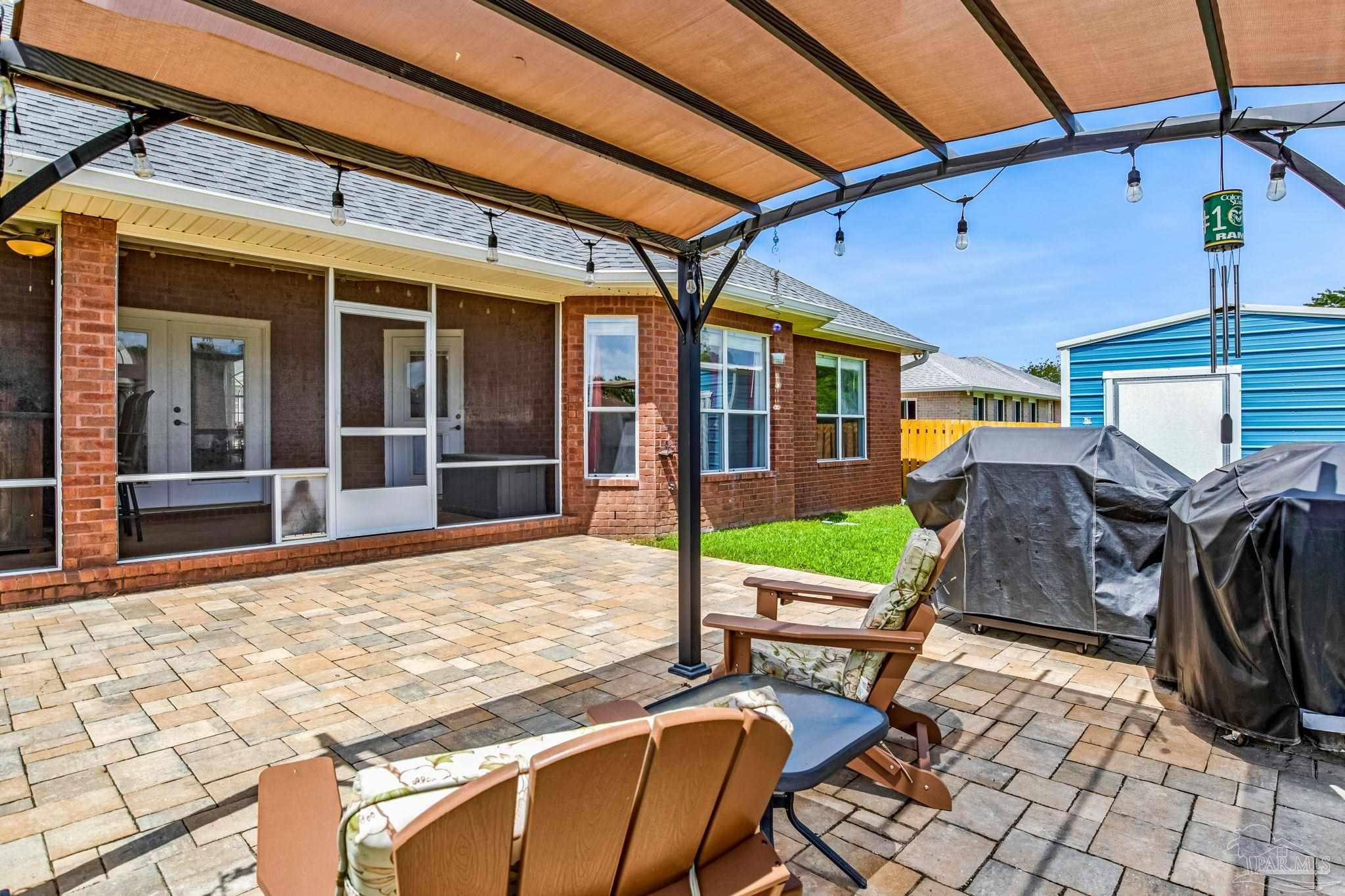 2822 Frederick Street Cantonment, FL 32533 - Photo 46 of 57 a view of an chairs and tables in the patio