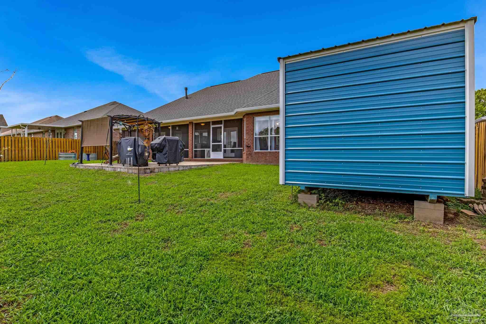 2822 Frederick Street Cantonment, FL 32533 - Photo 50 of 57 a view of a house with a yard