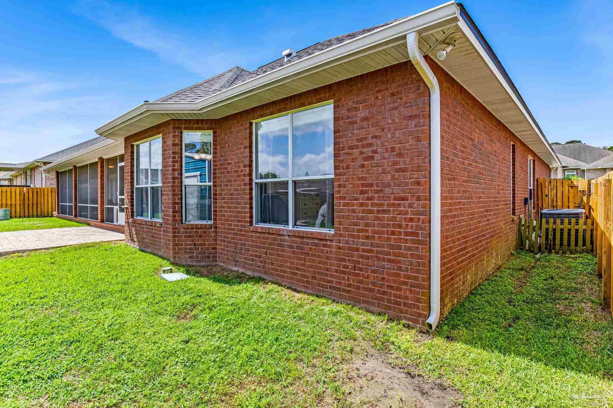 2822 Frederick Street Cantonment, FL 32533 - Photo 51 of 57 a front view of a house with garden
