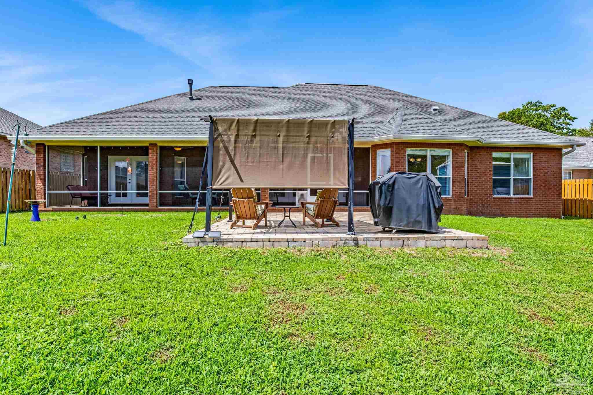 2822 Frederick Street Cantonment, FL 32533 - Photo 52 of 57 a view of a house with a yard porch and sitting area