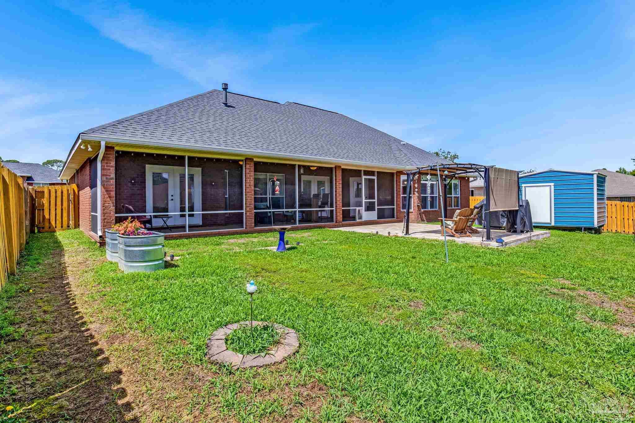 2822 Frederick Street Cantonment, FL 32533 - Photo 53 of 57 a front view of a house with garden