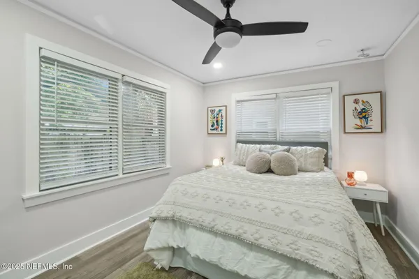 a bedroom with a large bed and a window