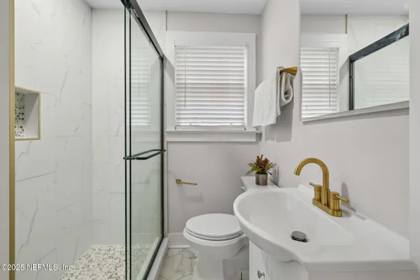 a bathroom with a sink and a toilet