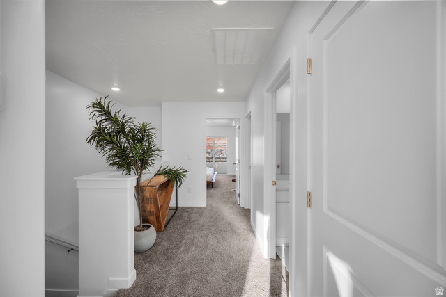 2202 Wolverine Way, Unit 2529 Washington, UT 84780 - Photo 13 of 27 Carpeted hallway featuring recessed lighting and white panel doors