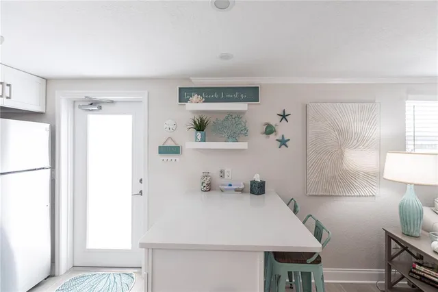 a view of kitchen island with furniture and wooden floor