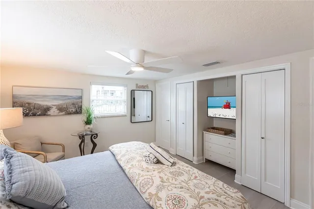 a bedroom with a bed and a cabinets
