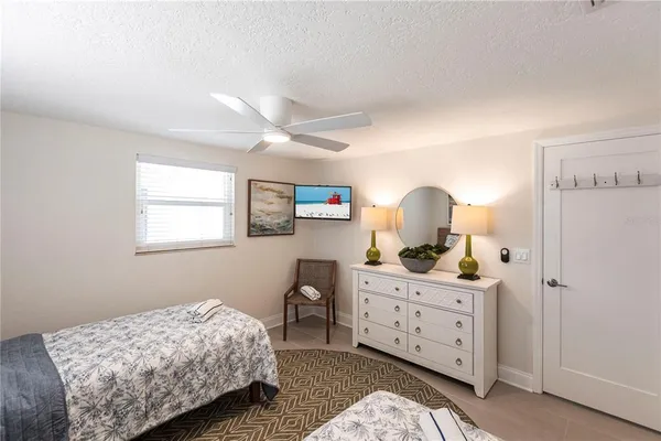 a bedroom with a bed and a dresser in it