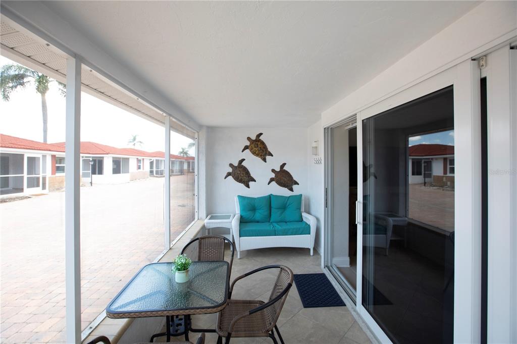 6154 Midnight Pass Road, Unit D15 Sarasota, FL 34242 - Photo 21 of 23 a workspace with furniture and a window