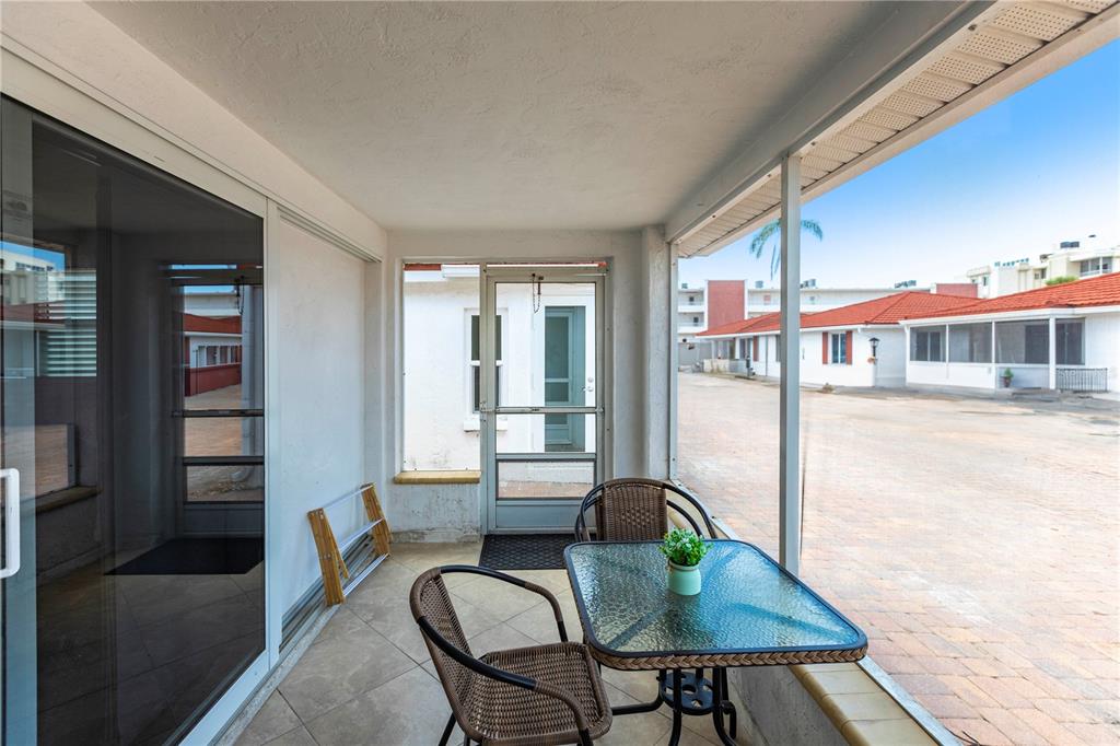 6154 Midnight Pass Road, Unit D15 Sarasota, FL 34242 - Photo 3 of 23 a view of a dining room with furniture and window